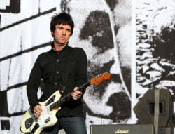 READING, ENGLAND - AUGUST 28: Johnny Marr of The Cribs performs live on the Main stage during day Two of Reading Festival on August 28, 2010 in Reading, England. (Photo by Simone Joyner/Getty Images)